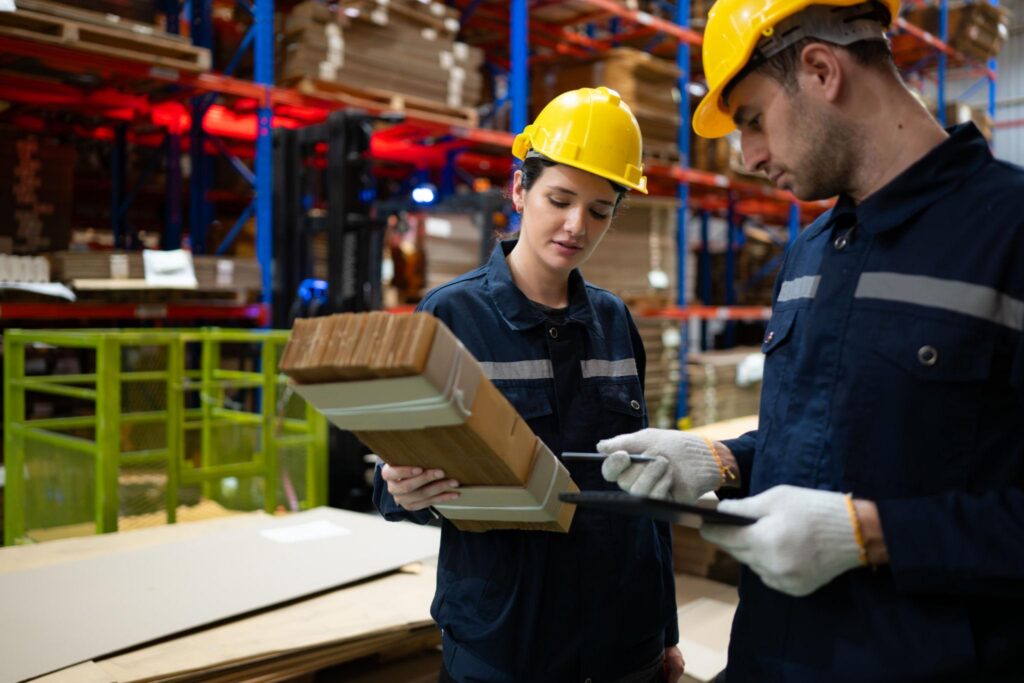Warehouse staff checking product quality, packaging condition, and shipment details before export