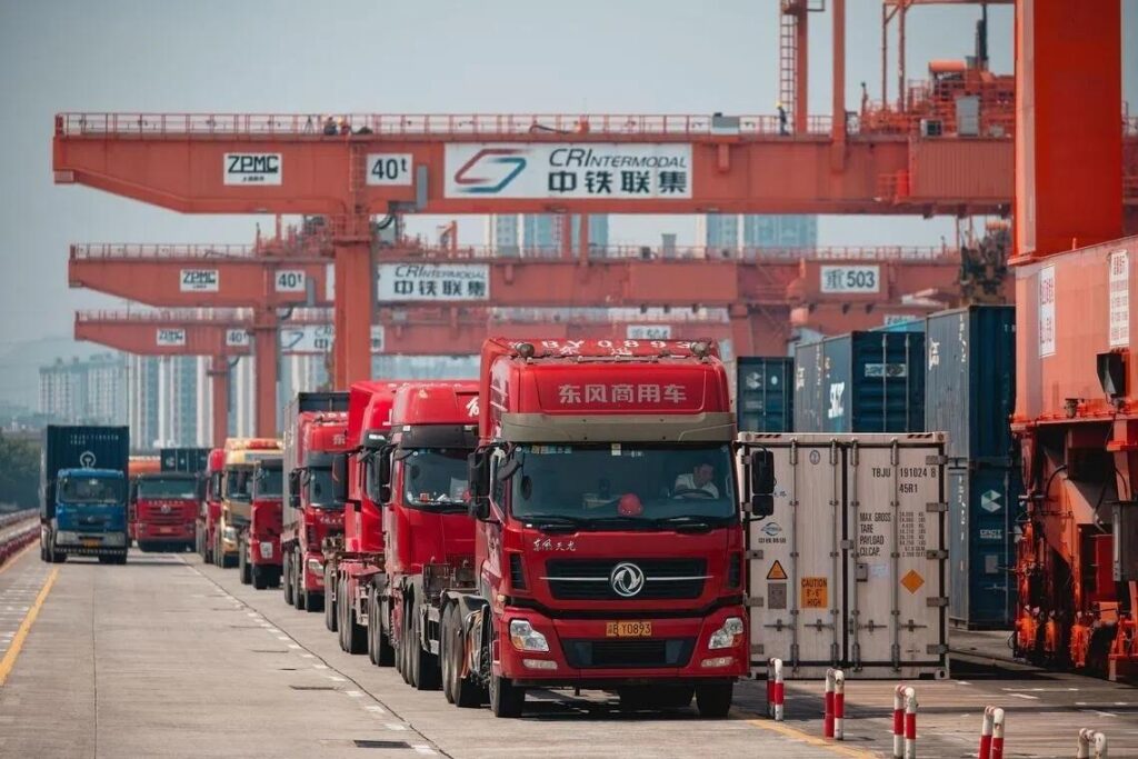 China factory truck transporting goods to port for EXW and FOB shipping comparison