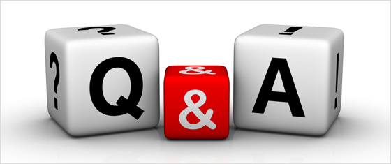 Three 3D dice spelling out "Q&A" in black and white against a red center die.